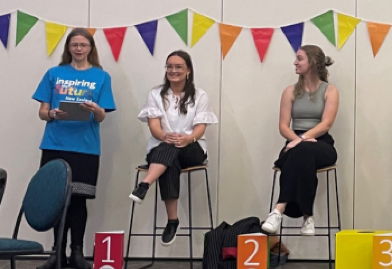 Three role models seated on a panel